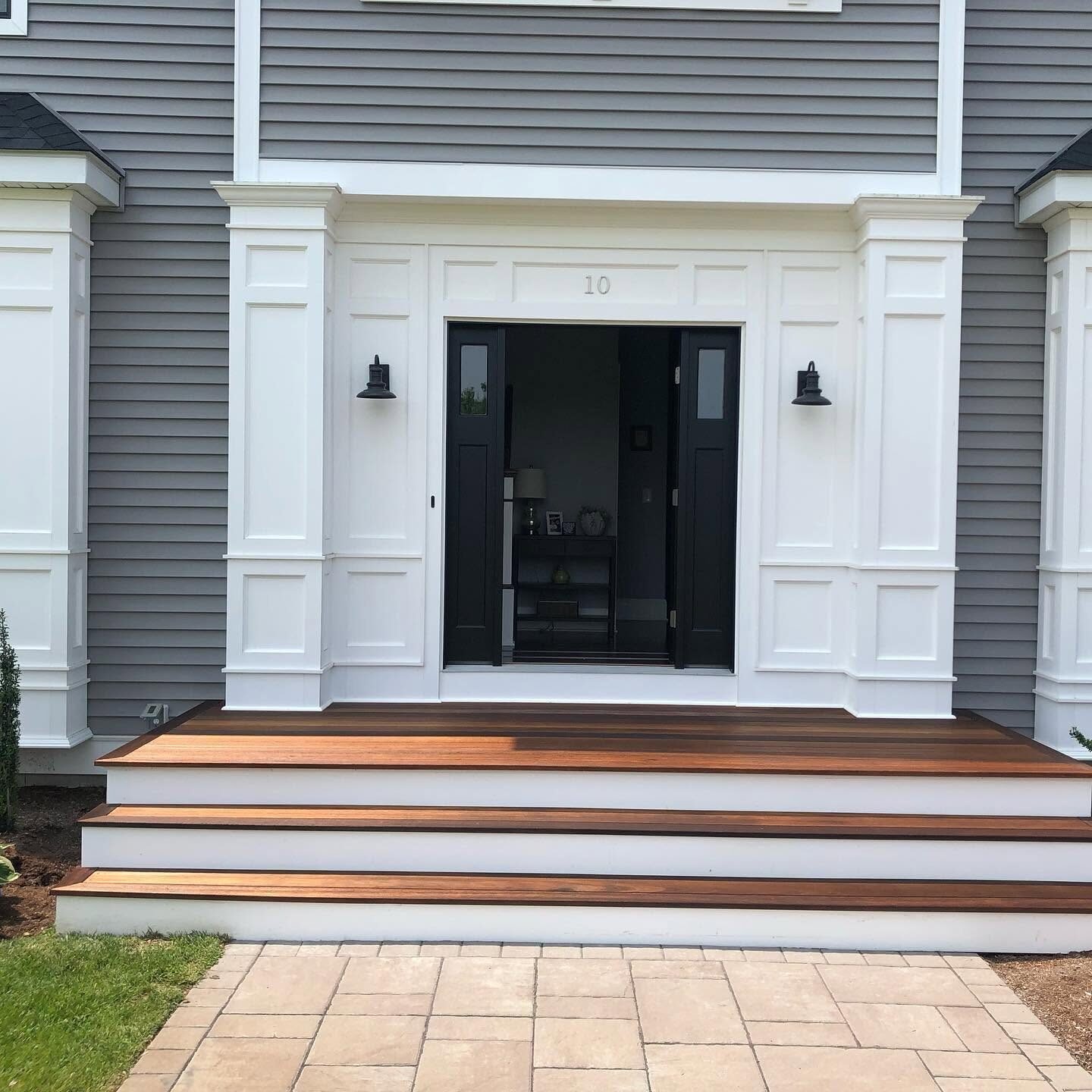 Front entry with painted trim and mahogany steps