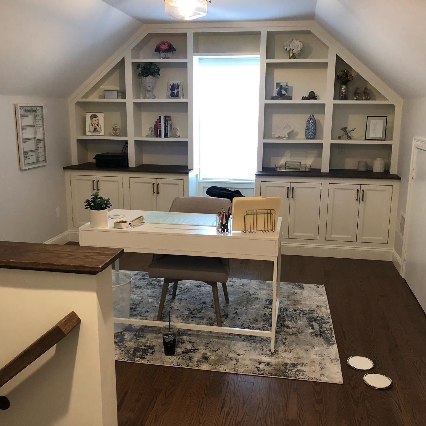 Home office with painted built-in shelving and desk