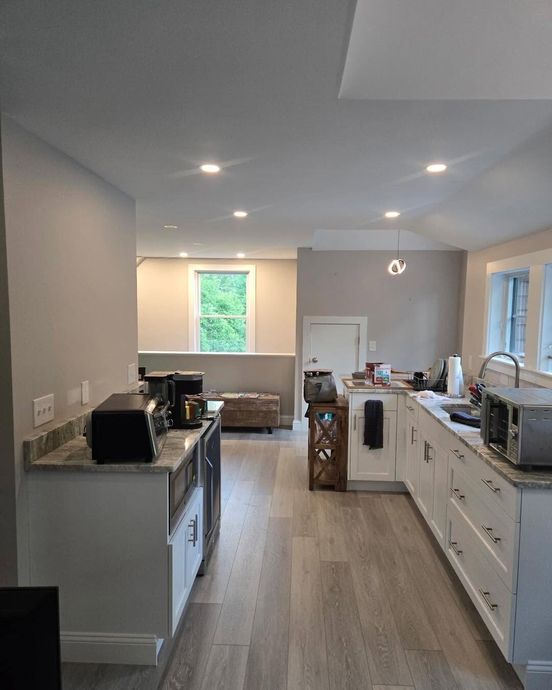 Kitchen with white finished cabinetry and painted walls