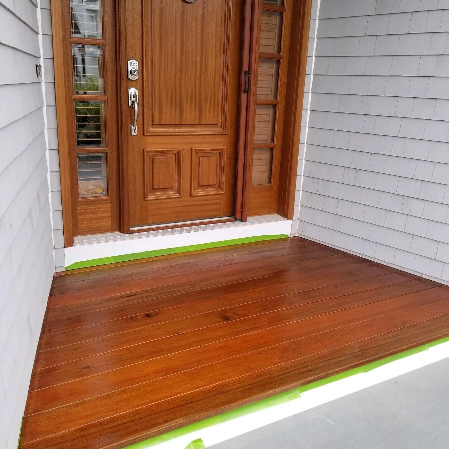 Varnished mahogany entry door and threshold