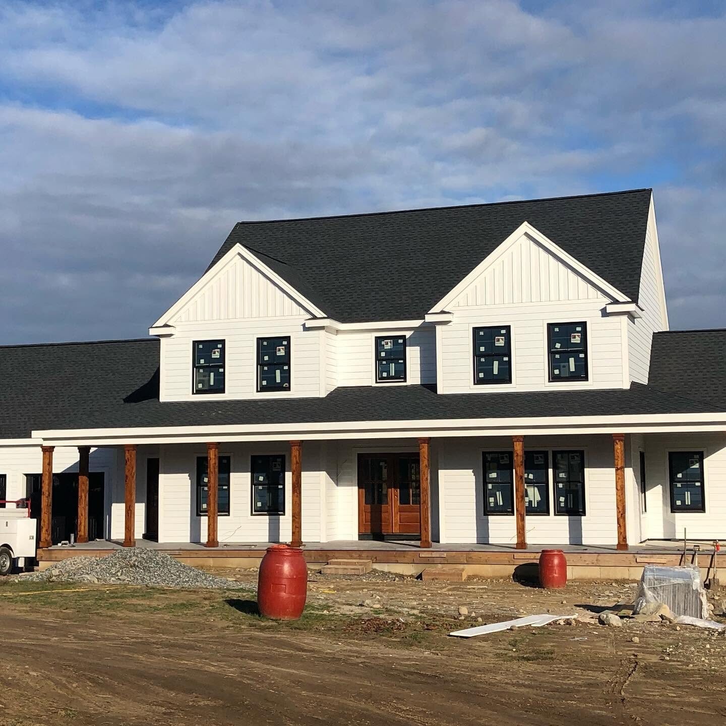 Modern farmhouse exterior painted white with black trim