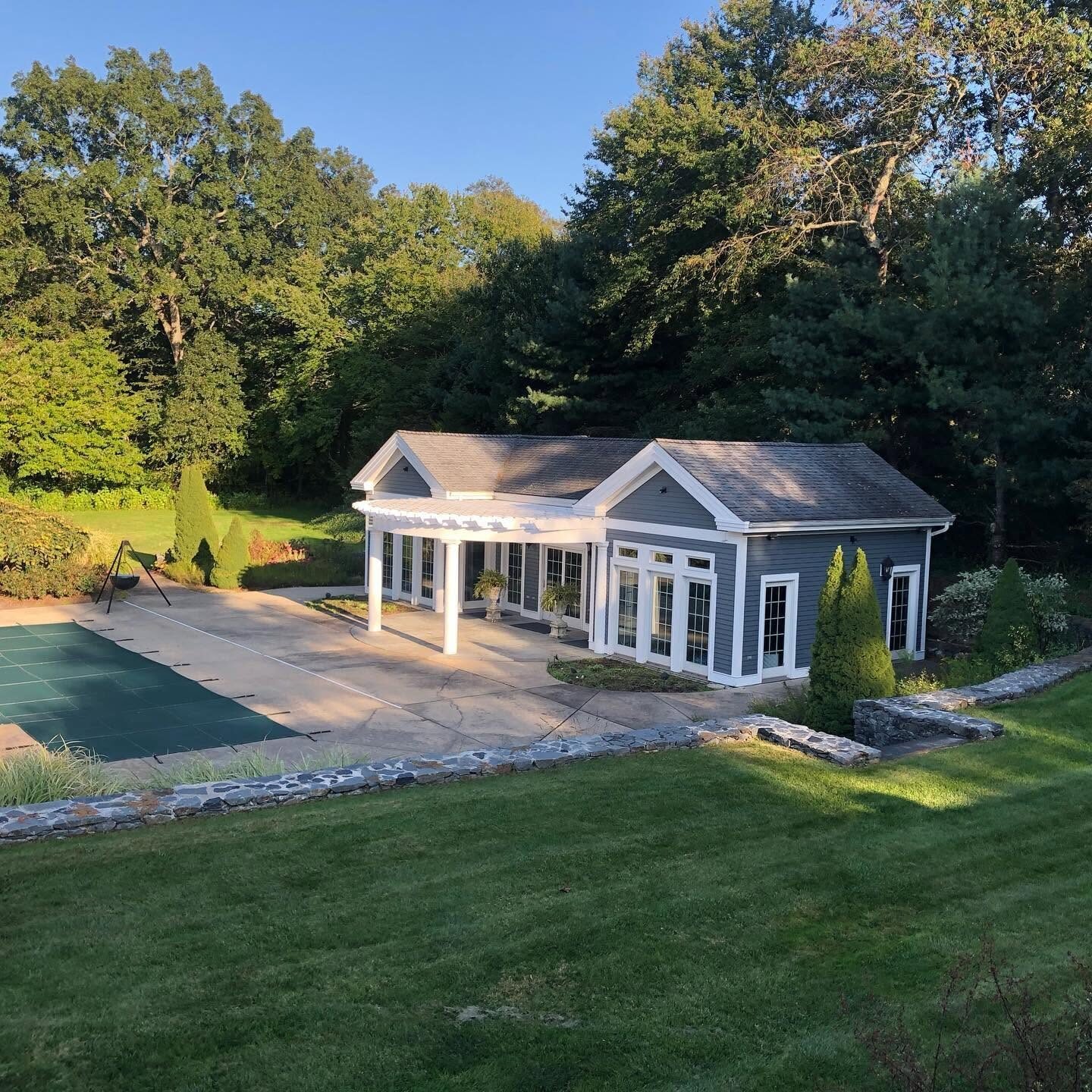 Pool house exterior painted white