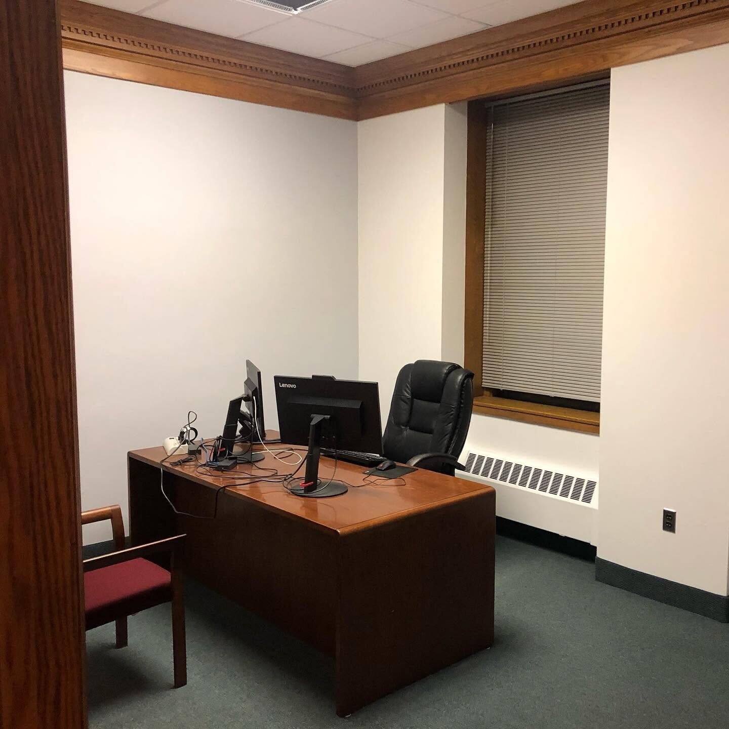 Private office repainted with wood trim